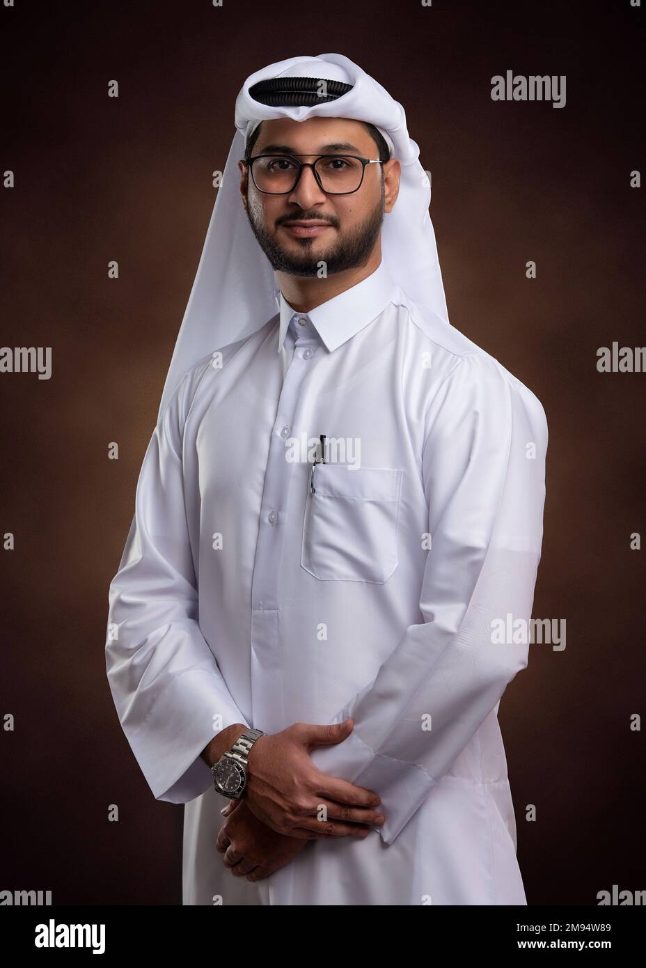 Male model in Arab Qatari dress on isolated background. Portrait of