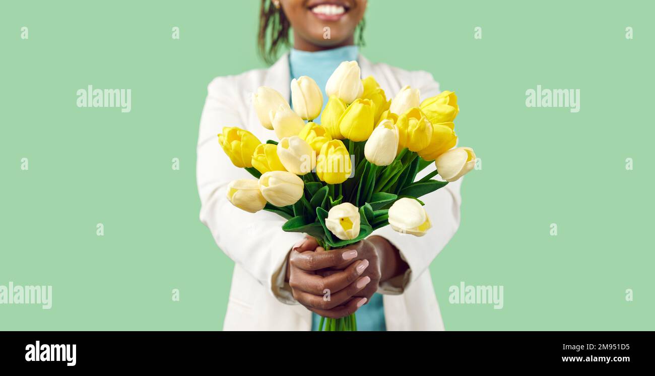 Banner of black woman hold flower bouquet greeting Stock Photo