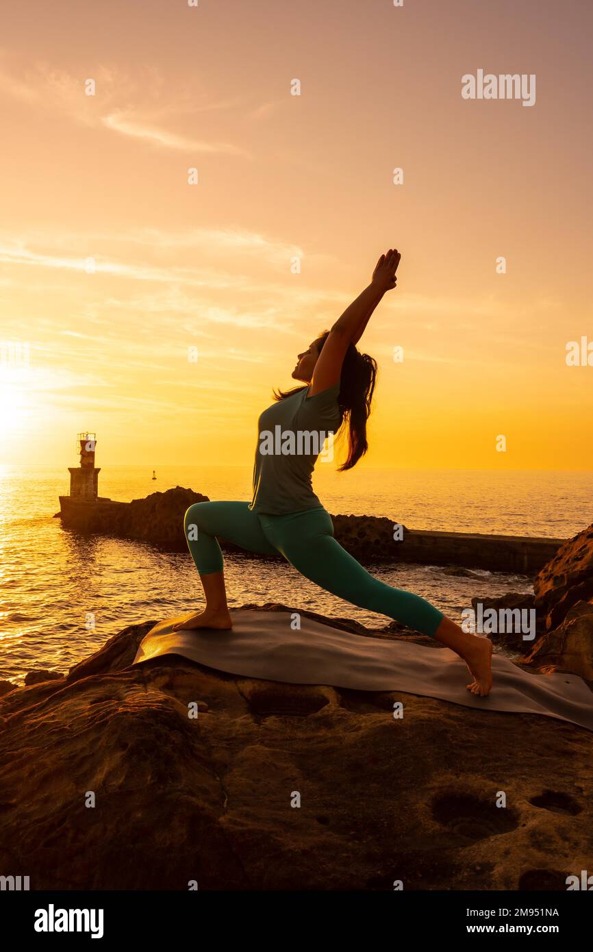 Anjaneyasana, A woman doing meditation and yoga exercises on a
