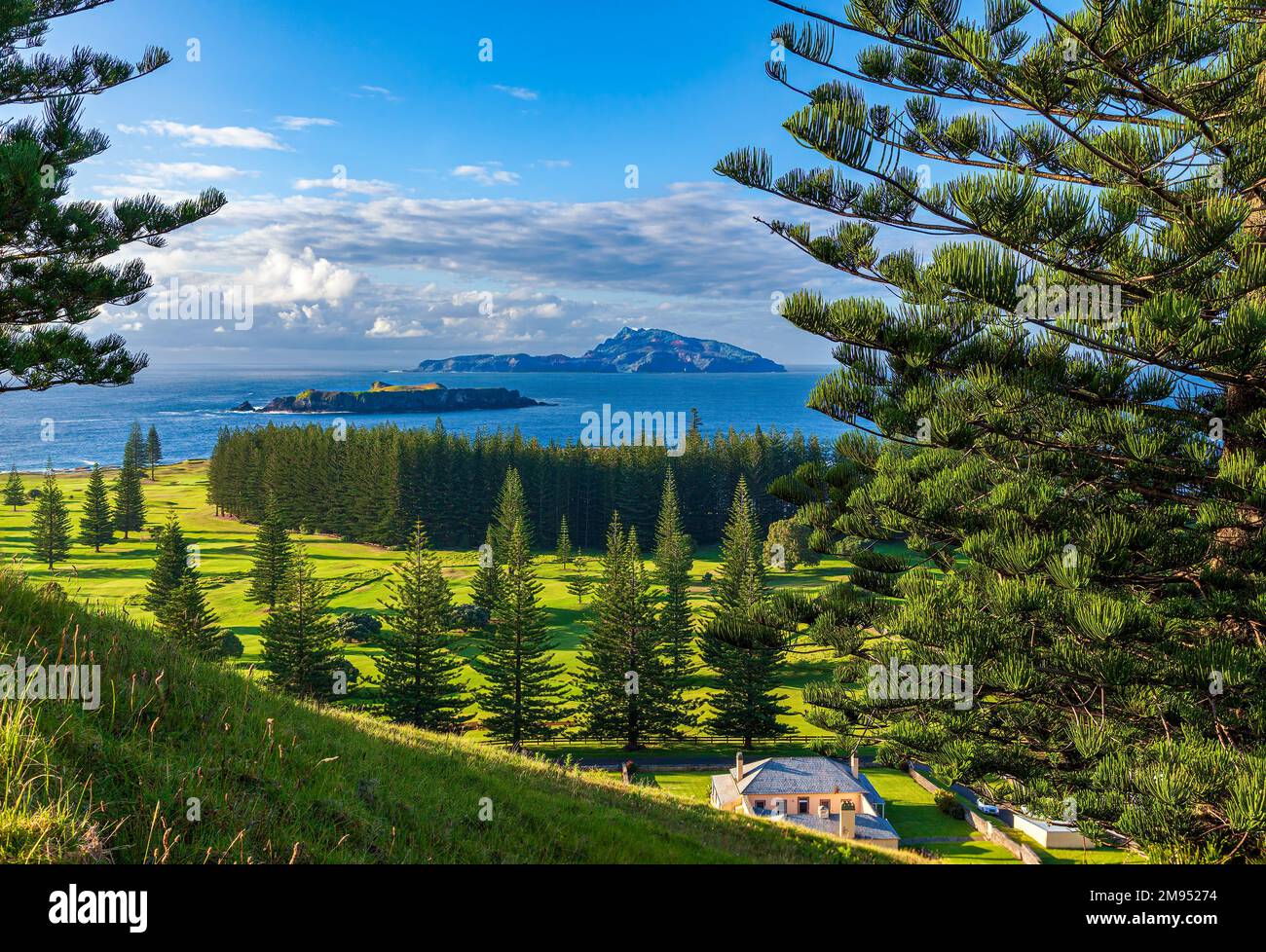 Golf course on Norfolk Island. in the background is Phillip and Nepean islands, part of the world heritage site of Kingston. Stock Photo