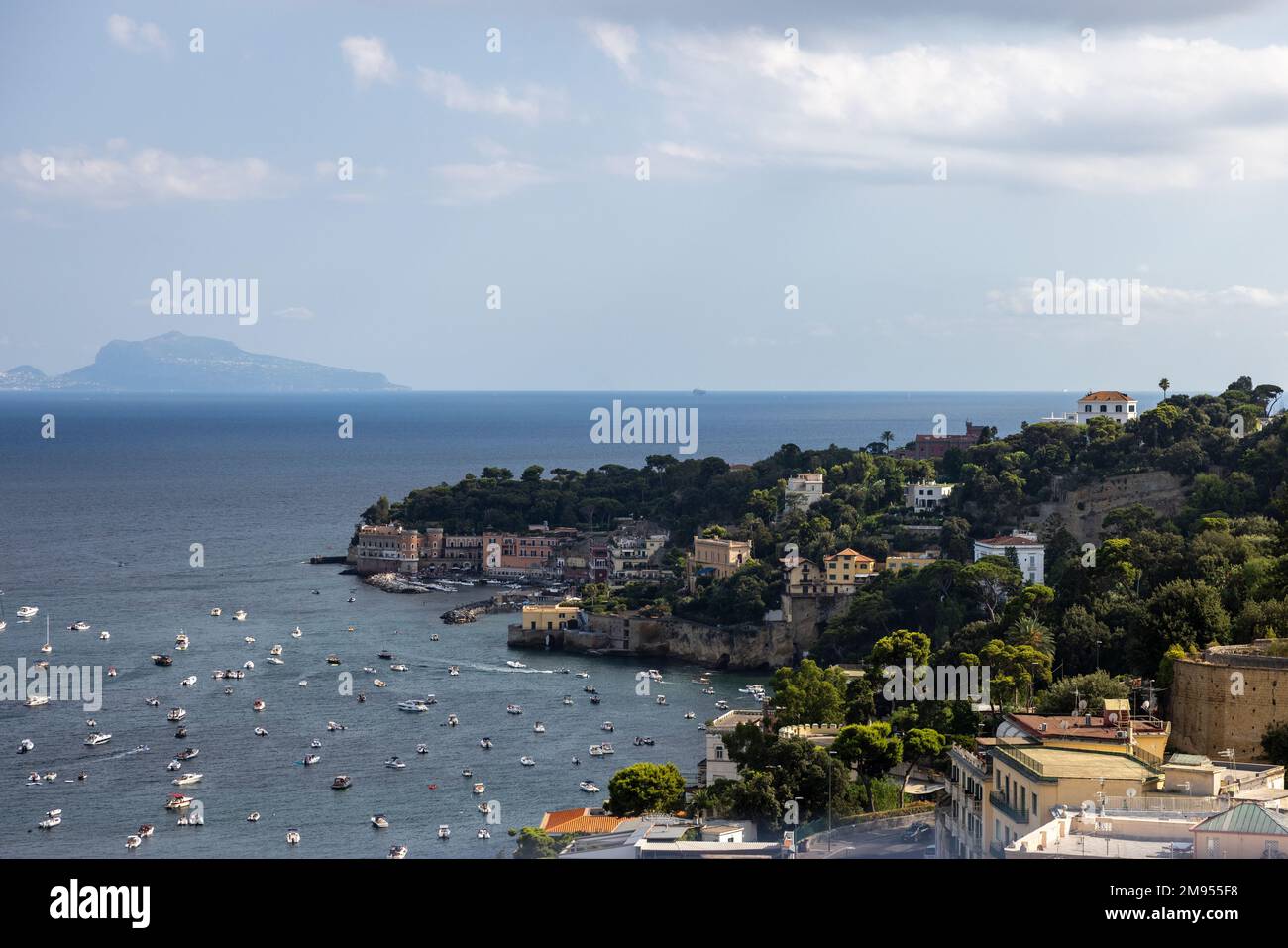 An aerial view of sea with beach surrounded by buildings in Italy Stock ...