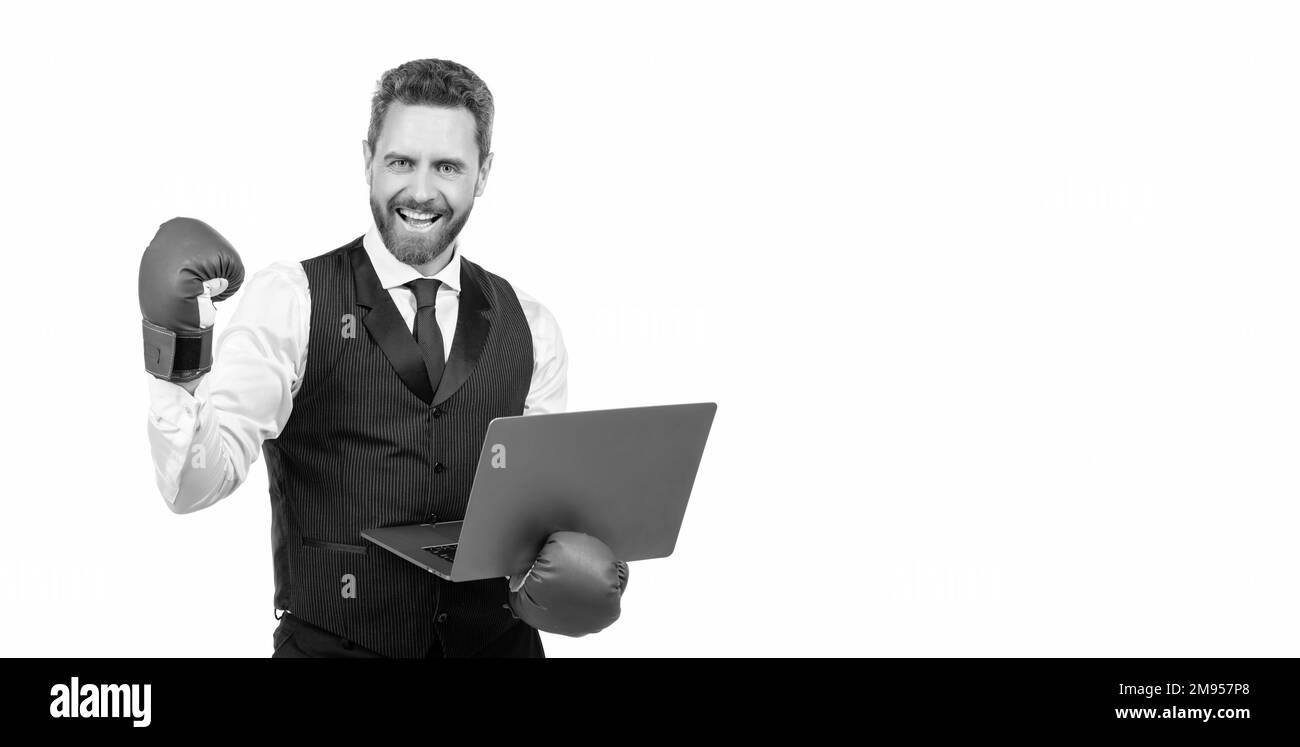 happy man boss hold laptop in boxing gloves. anger management. cyber bullying. Stock Photo