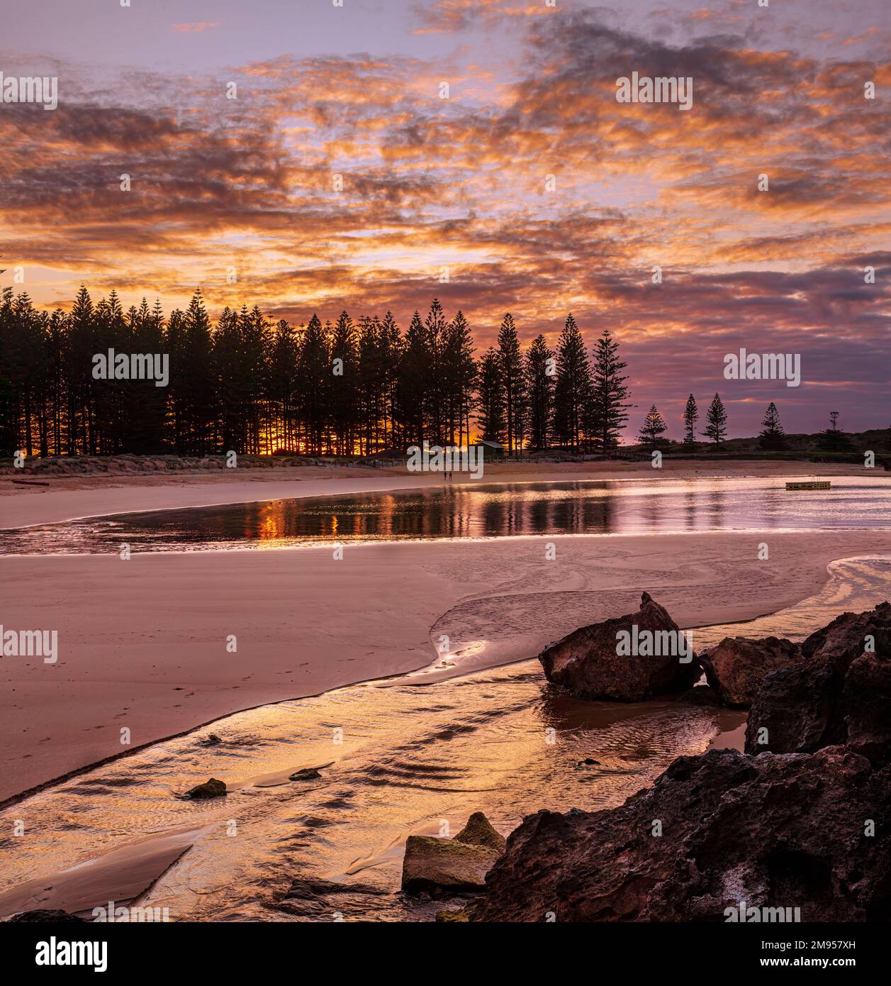 Sunrise at Emily Bay. Part of the world heritage site of Kingston,Norfolk Island, South Pacific. Stock Photo