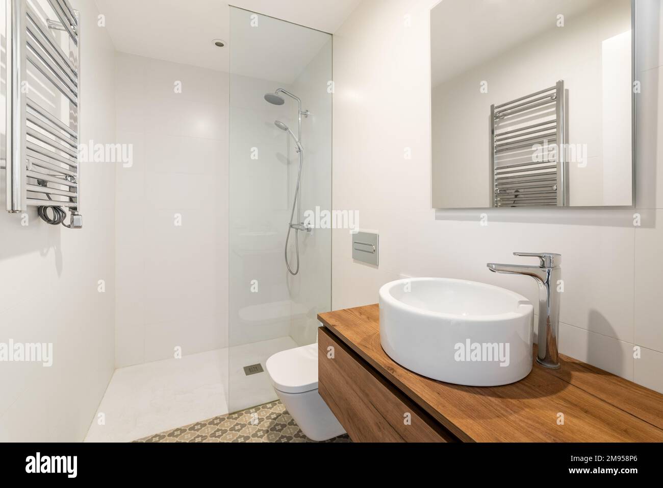 Sink Over Radiator Bathroom with small round white sink on long wooden countertop floating ...