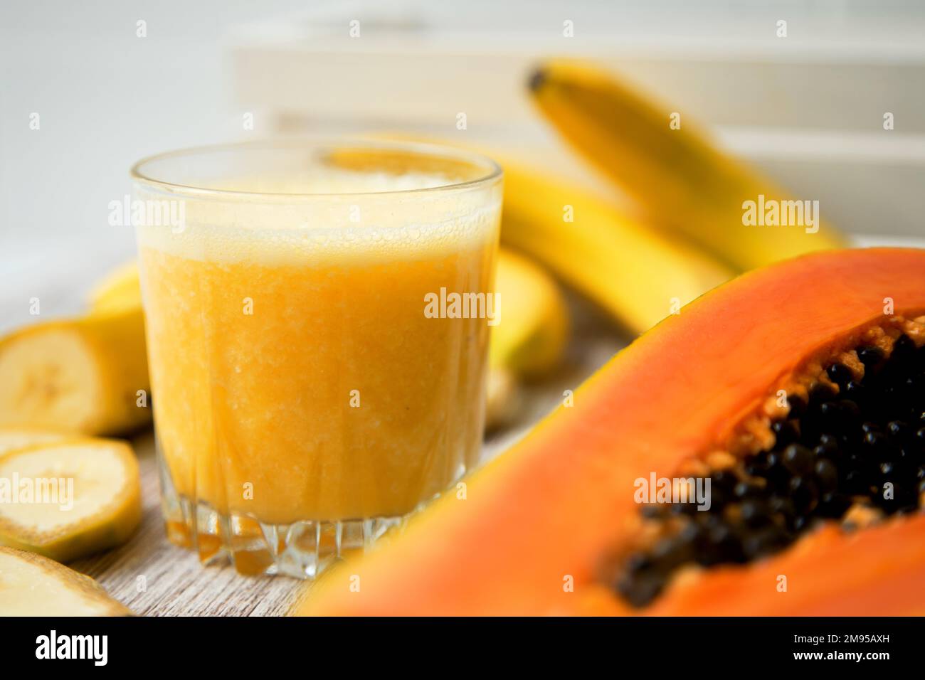 Tropical juice with banana and papaya Stock Photo Alamy