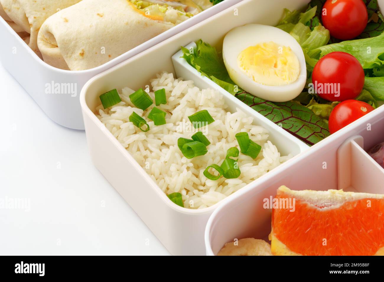 Lunch boxes with healthy food isolated on white Stock Photo - Alamy