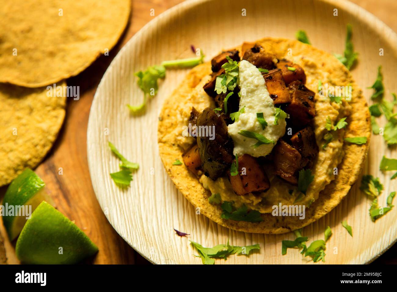 Vegetarian tostadas with hummus. Tostada, name given to various dishes in Mexico that include a