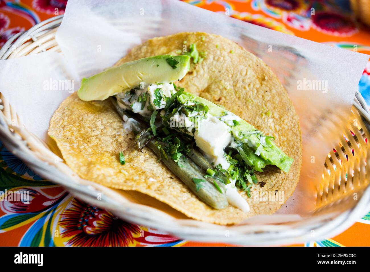 Vegetarian tacos. A taco is a traditional Mexican food consisting of a small hand-sized corn tortilla Stock Photo