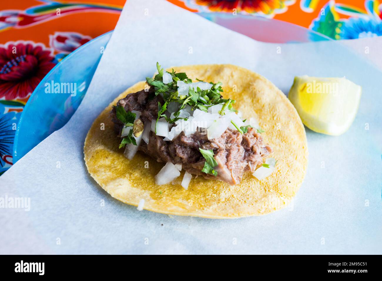 Beef tacos. A taco is a traditional Mexican food consisting of a small handsized corn tortilla