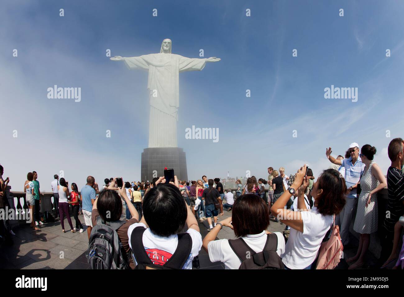 Brazil, Rio, tourists taking pictures at the statue of Cristo Redentor
