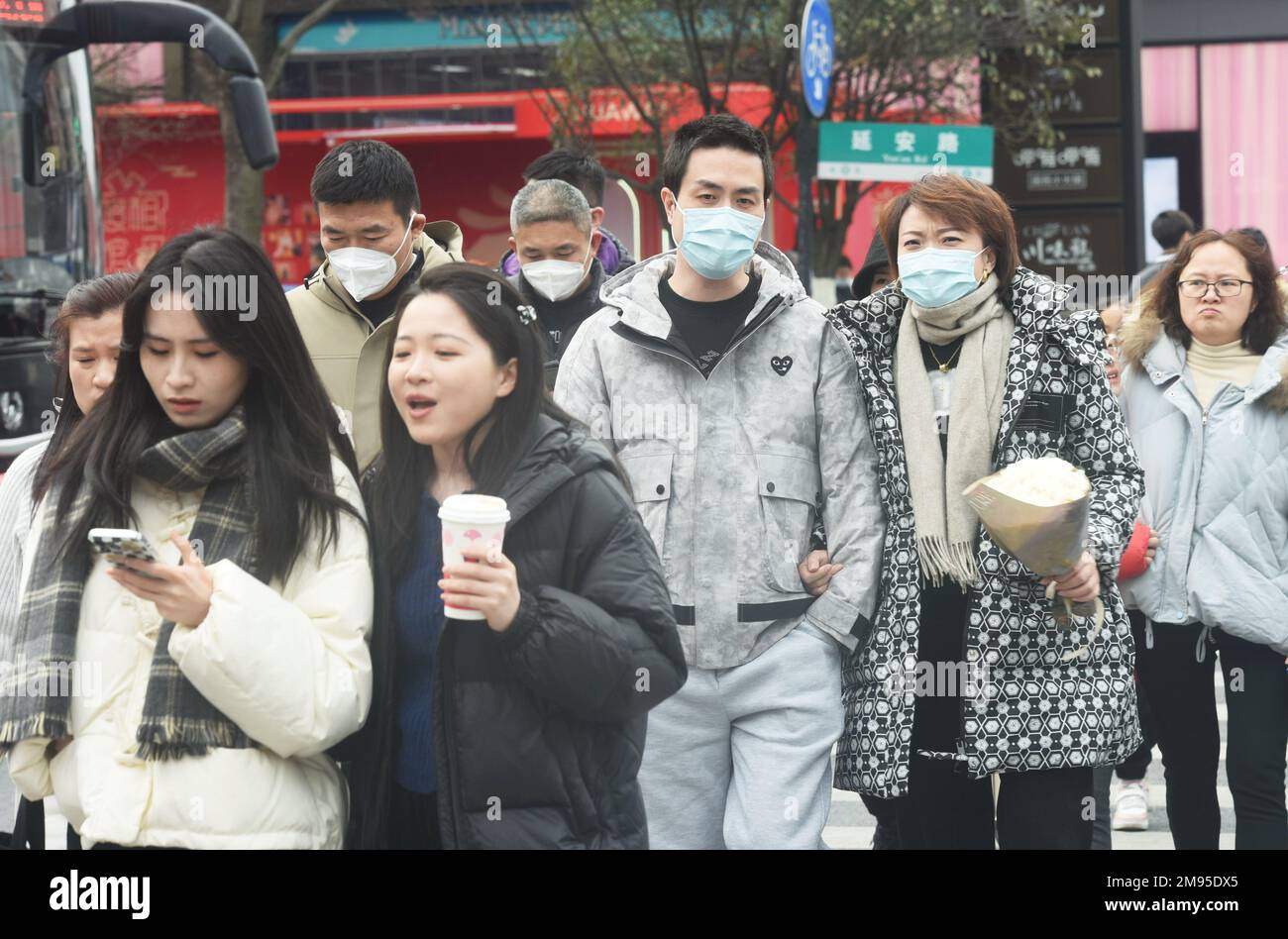 HANGZHOU, CHINA - JANUARY 17, 2023 - Citizens walk on a street in ...