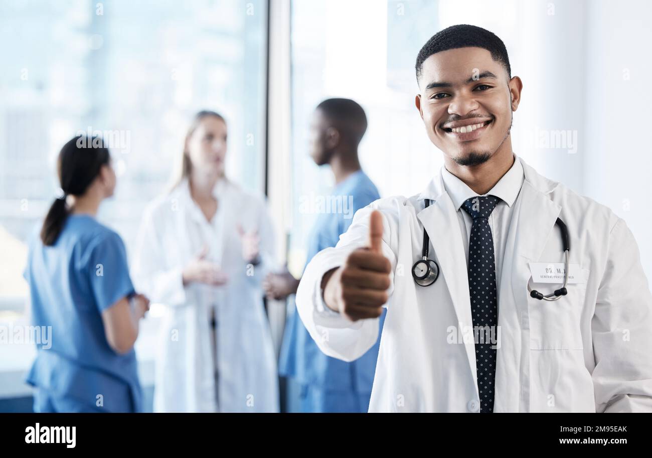 Helping others live their ideal lives. a young male doctor giving the thumbs up. Stock Photo