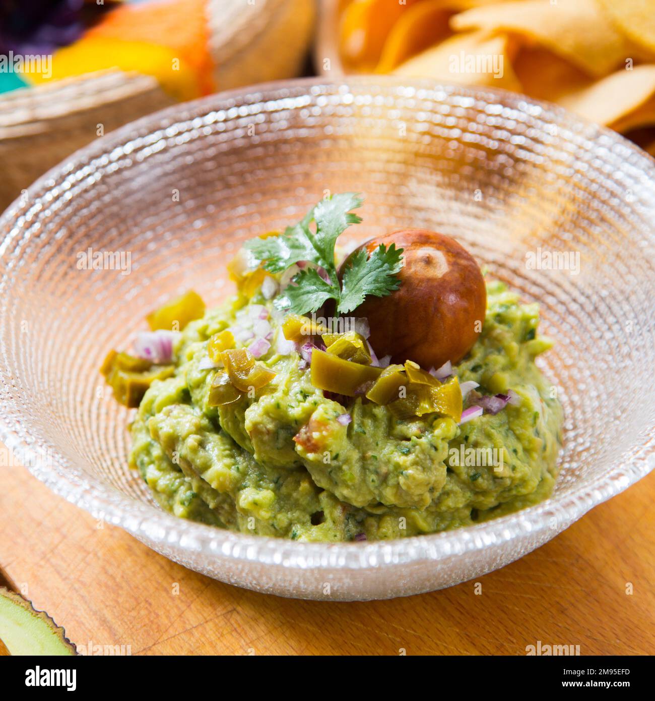 Guacamole is an avocado-based dip, spread, or salad first developed in Mexico. Stock Photo