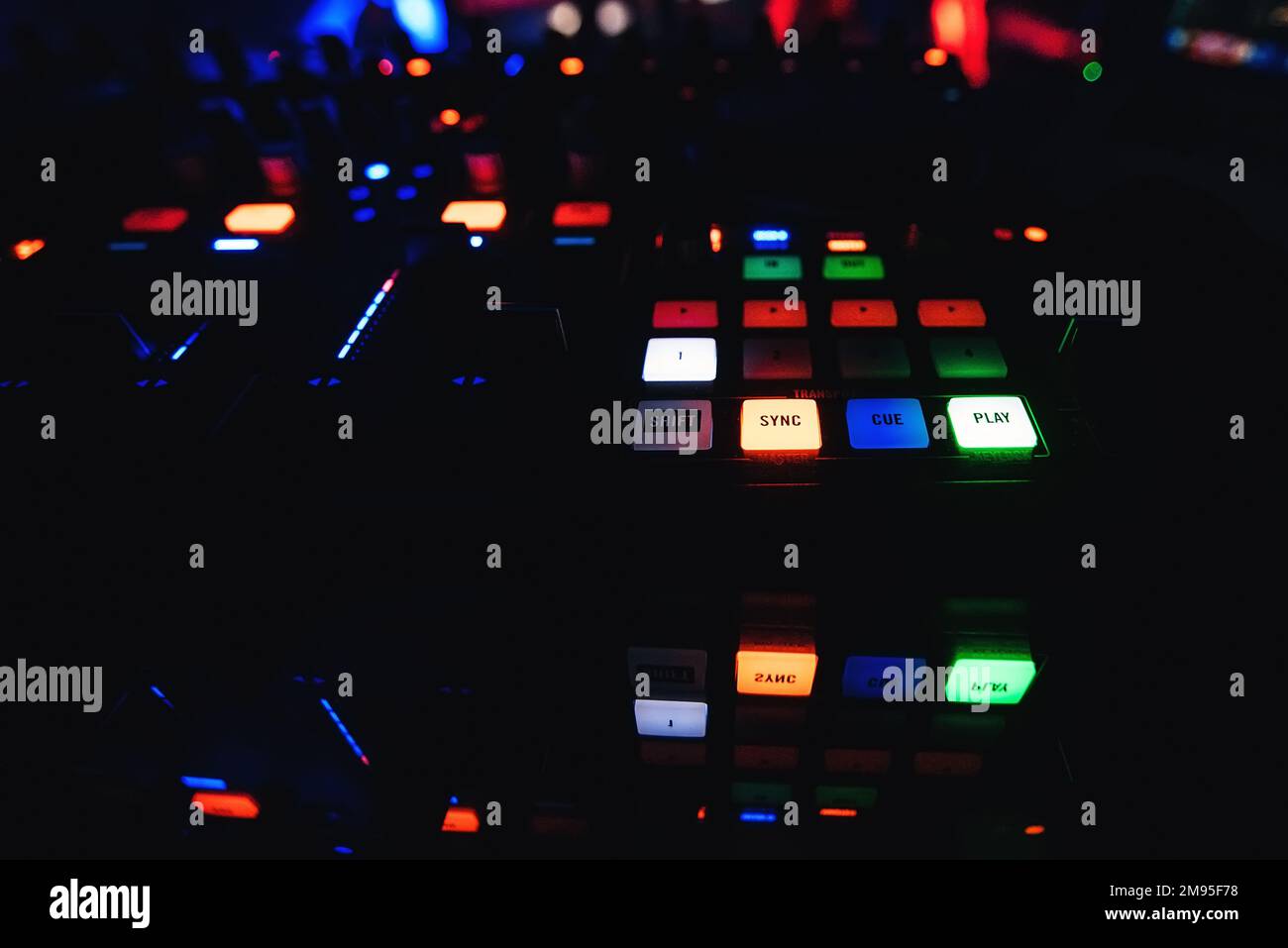 buttons on the mixer DJ with lighting for creating and mixing music