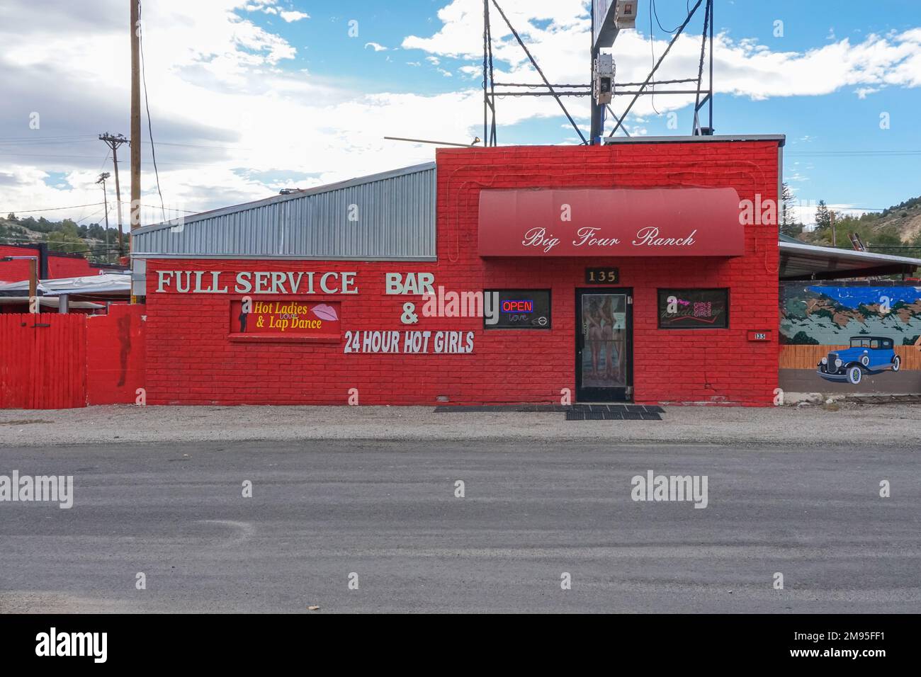 The red building facade of the Big Four Ranch, one of the oldest