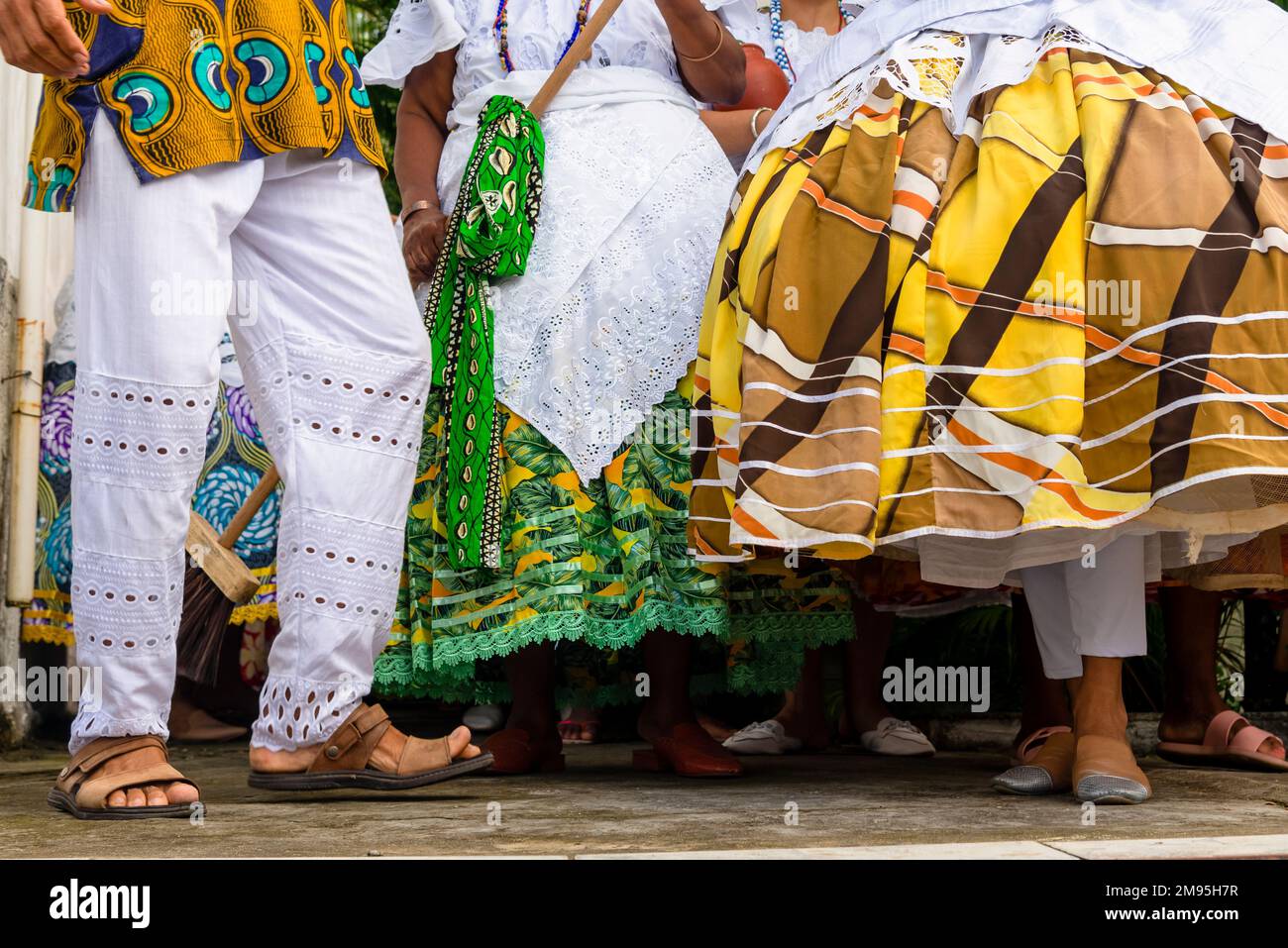 A closeup shot of Candomble members dressed in traditional clothes for a religious festival Stock Photo