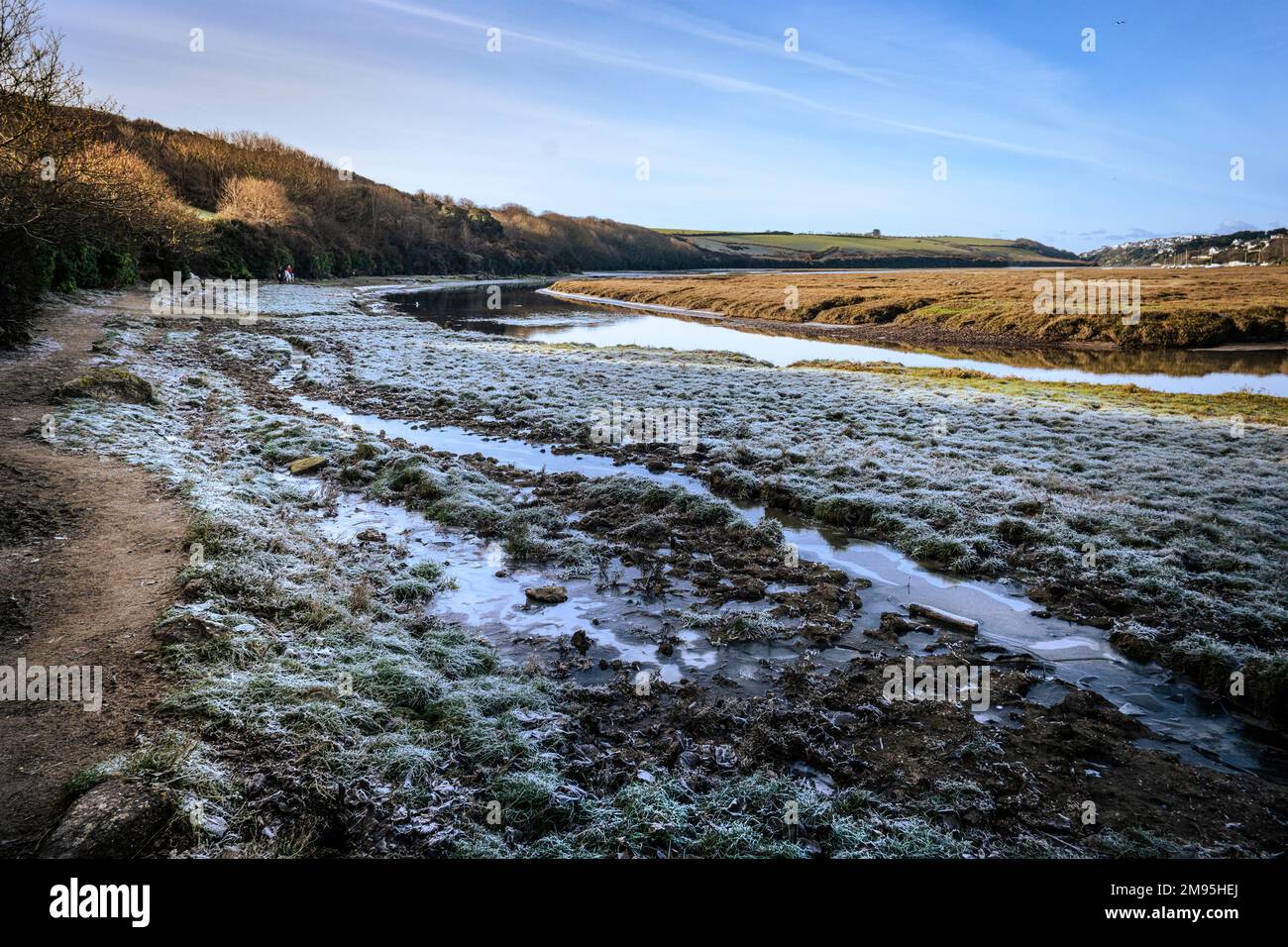 Frost on the ground of the Gannel Estuary at low tide in Newquay in Cornwall in the UK. Stock Photo