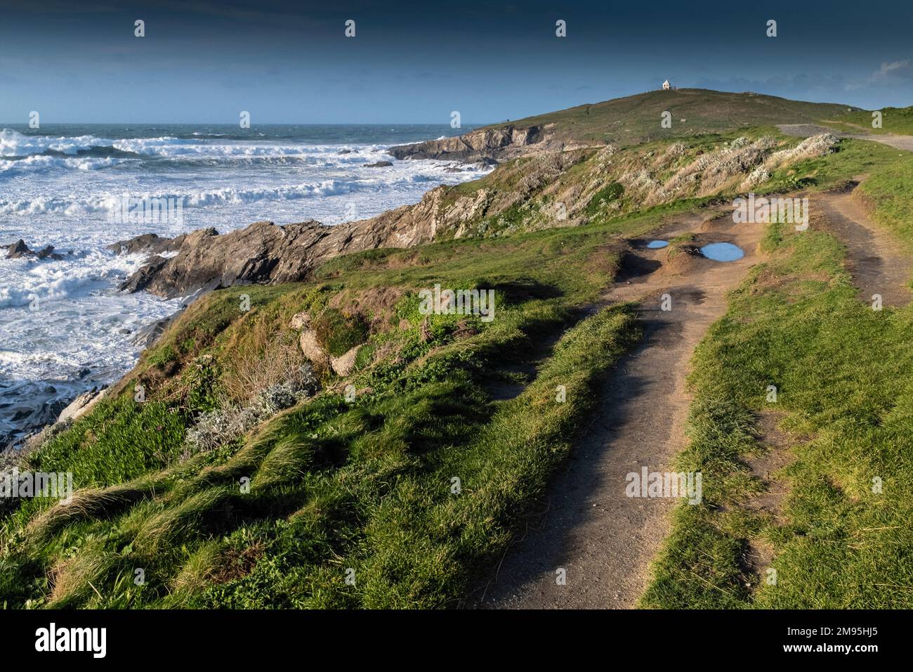 The eroded and worn rough footpaths on the coast of Newquay in Cornwall in England in the UK. Stock Photo