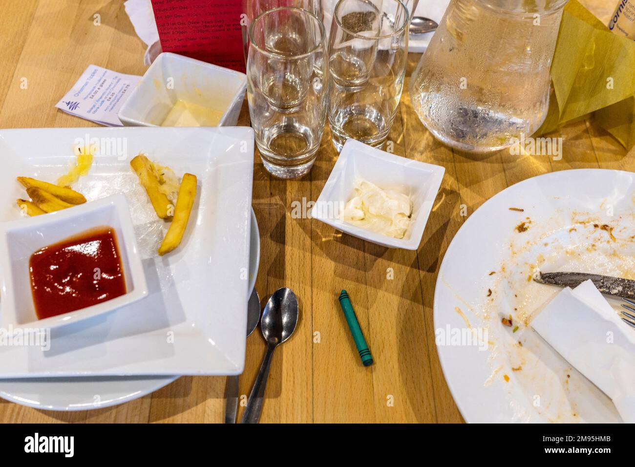 An overhead view of a table after a meal in a restaurant. Stock Photo