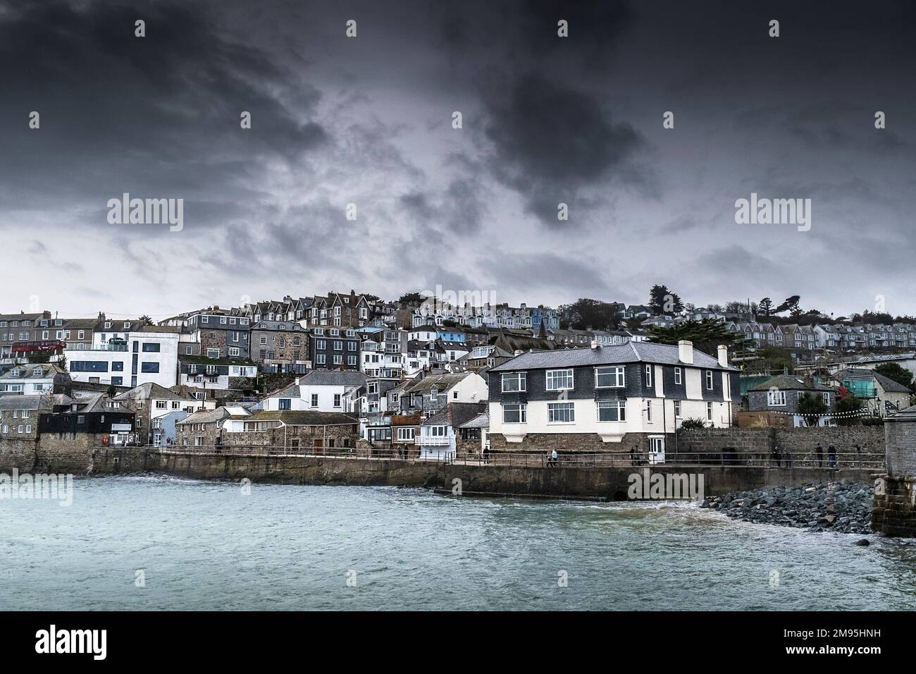 UK weather.  A cloudy chilly miserable day in the historic seaside town of St Ives in Cornwall in England in the UK. Stock Photo