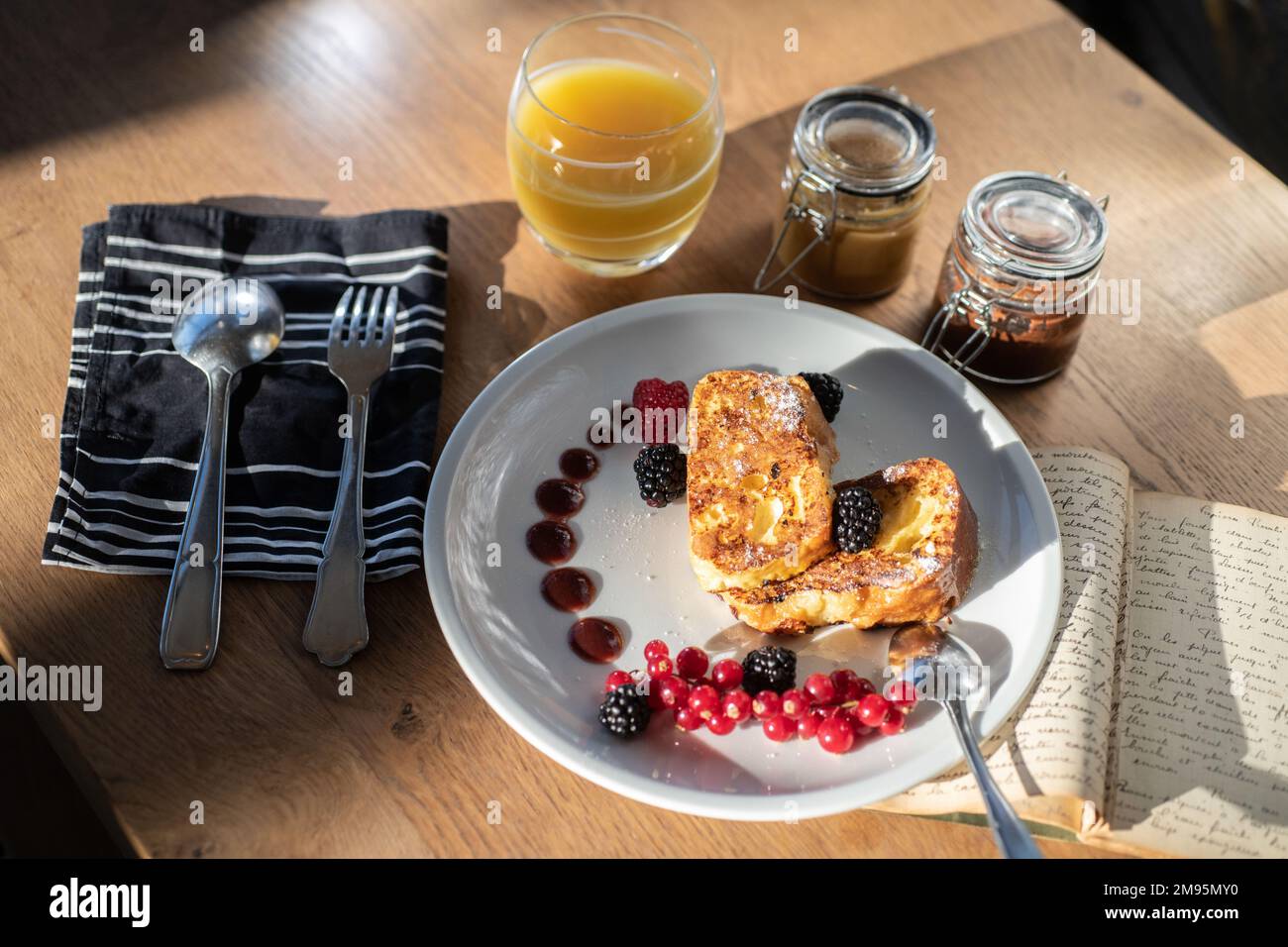 “Pain perdu”, French toast prepared with a brioche called “Pogne de Romans”, typical from the Drome department (south-eastern France). “Pain perdu” an Stock Photo