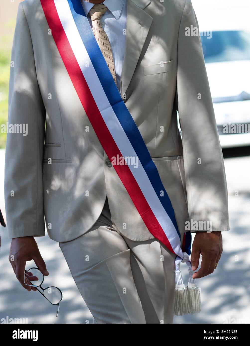 Local elected representative with a tricolour sash Stock Photo