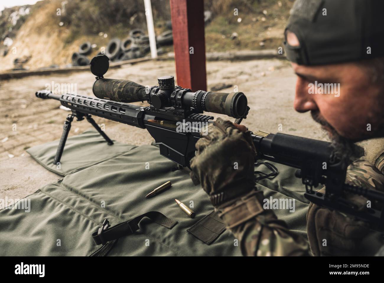 Soldier with rifle bfor shooting the target Stock Photo