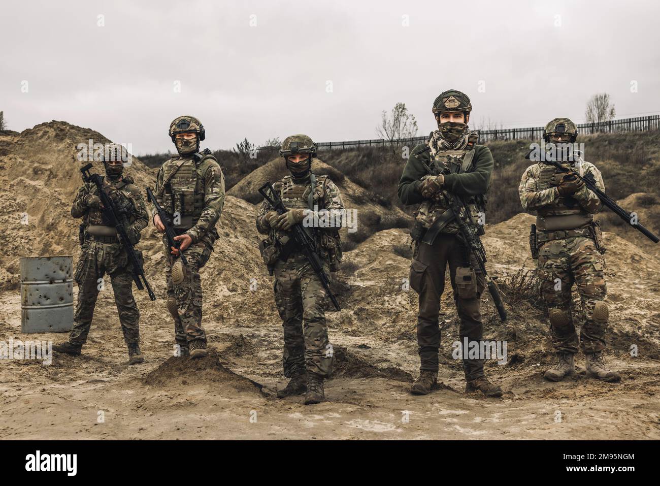 Soldiers on a shooting range looking concentrated and attentive Stock Photo