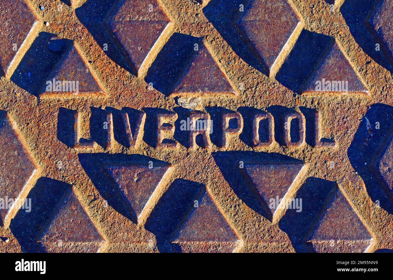 Rusty Liverpool embossed cast iron street grid, Merseyside, England, UK, L1 2SF Stock Photo