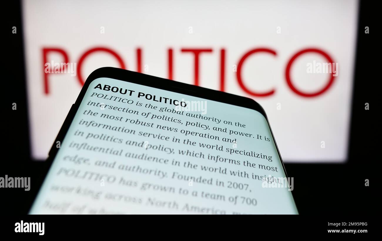 Mobile phone with webpage of US political newspaper company Politico LLC on screen in front of business logo. Focus on top-left of phone display. Stock Photo
