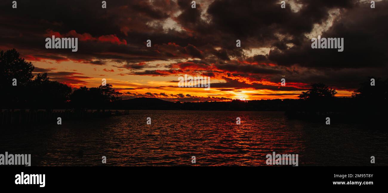 A breathtaking panotamic view of the red sunset over the sea Stock ...