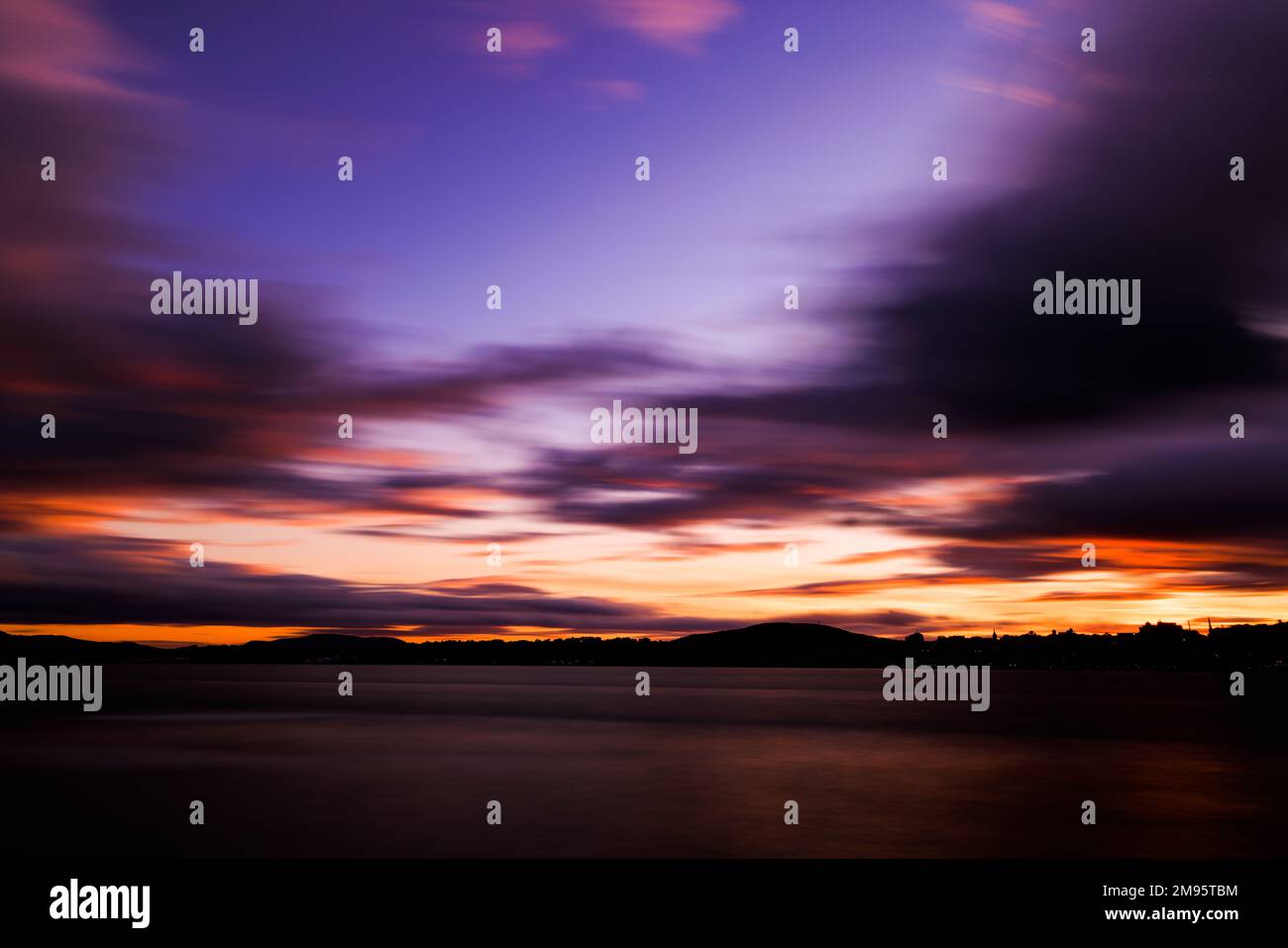 A breathtaking view of the red sunset over the sea Stock Photo - Alamy