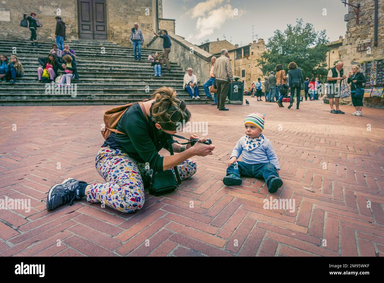A lady taking a picture of her child Stock Photo