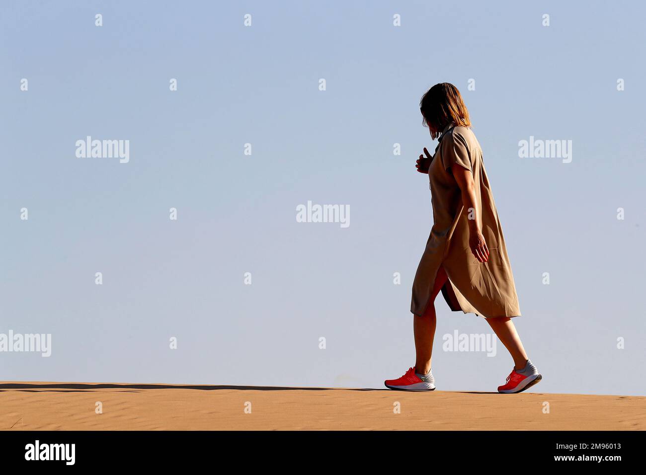 Woman walking alone hi-res stock photography and images - Alamy