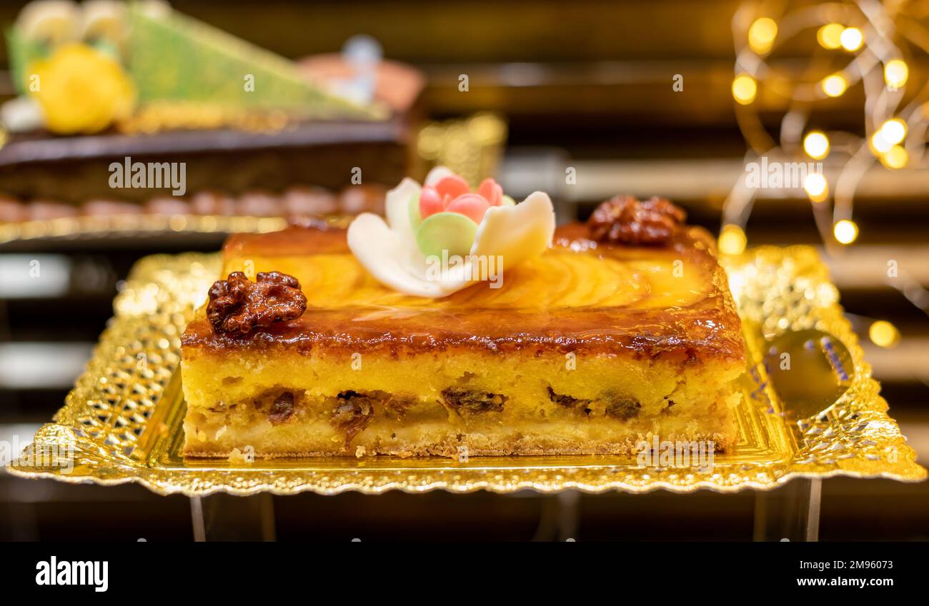 Delicious fresh baked colorful decorated cakes, tarts with cream and ...