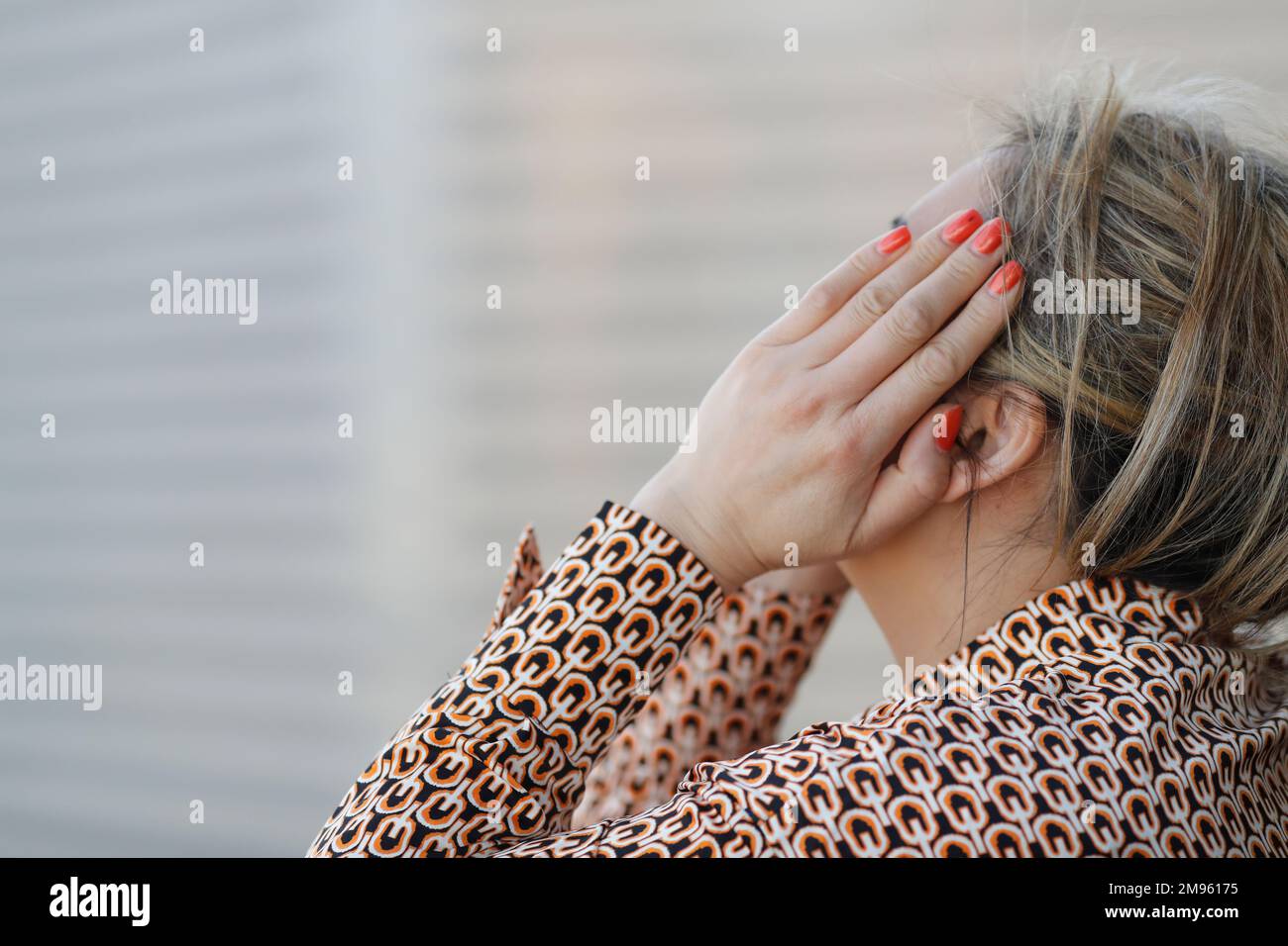 Woman covering her face with her hand. Depression Stock Photo - Alamy