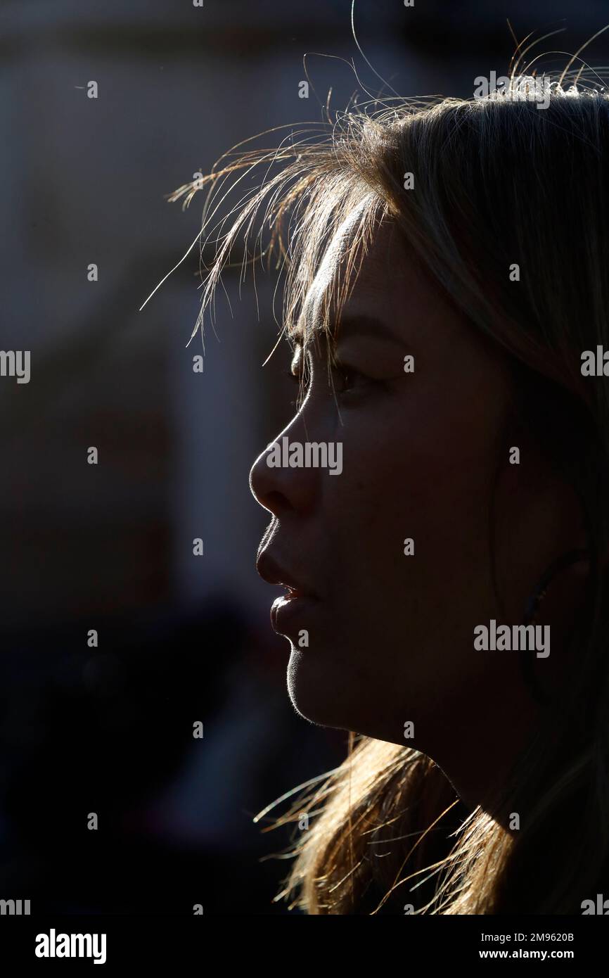 Profile view of silhouette woman standing outside during sunset. Stock Photo