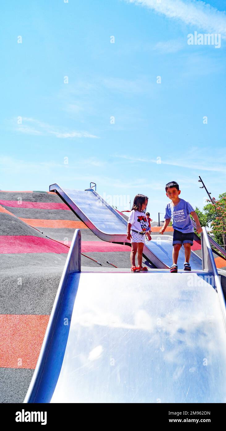 slides and swings in a playground in a neighborhood of Barcelona