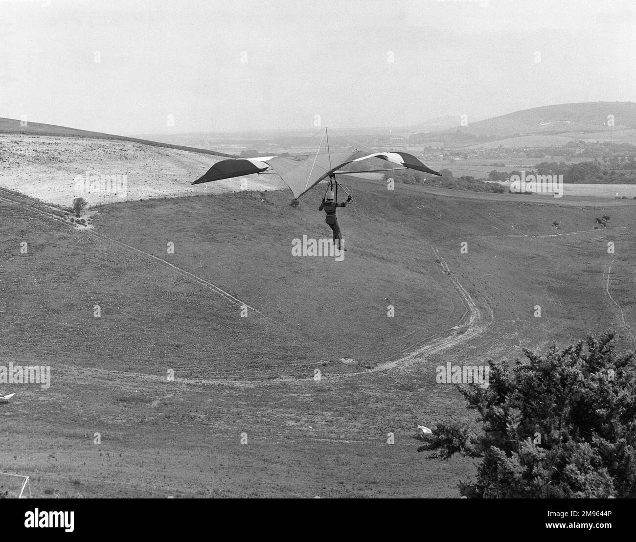 A hang glider enjoys the view above Steyning Bowl, Sussex, England. Stock Photo