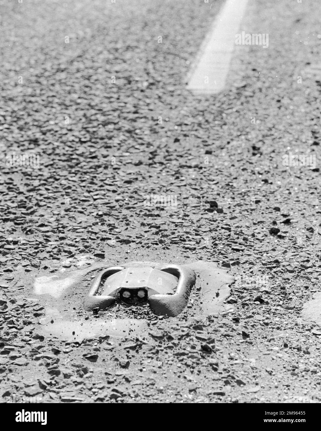 A 'Cats' Eye' road marking. Cats' eyes were invented in 1933 by Percy