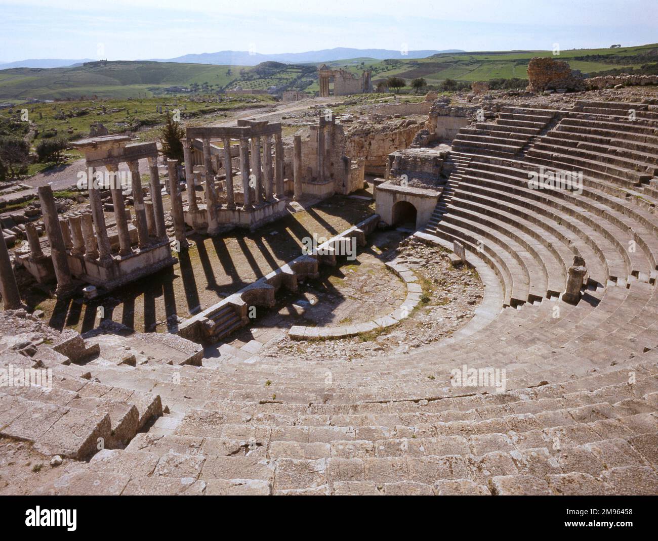 The Roman Theatre at DOUGGA, Tunisia. Dougga served as one of the capitals of Massinissa, a Roman ally, and one of the contenders to Carthage. Stock Photo