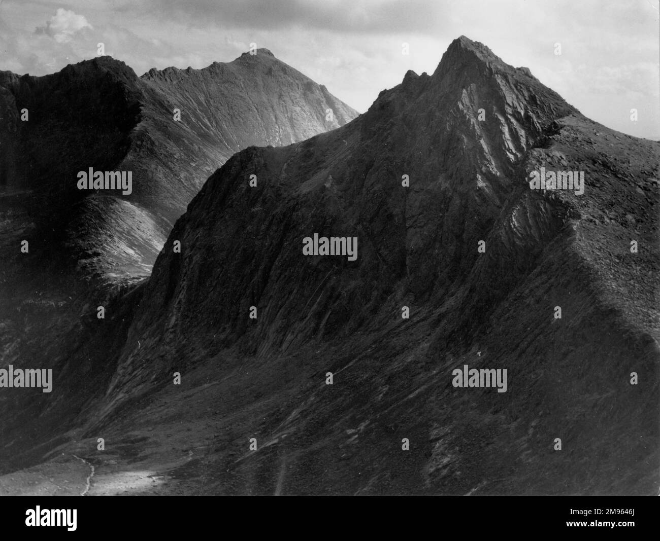A dramatic impression of the mountains of Cir Mhor and Goatfell (behind), on the Isle of Arran, Scotland. Stock Photo