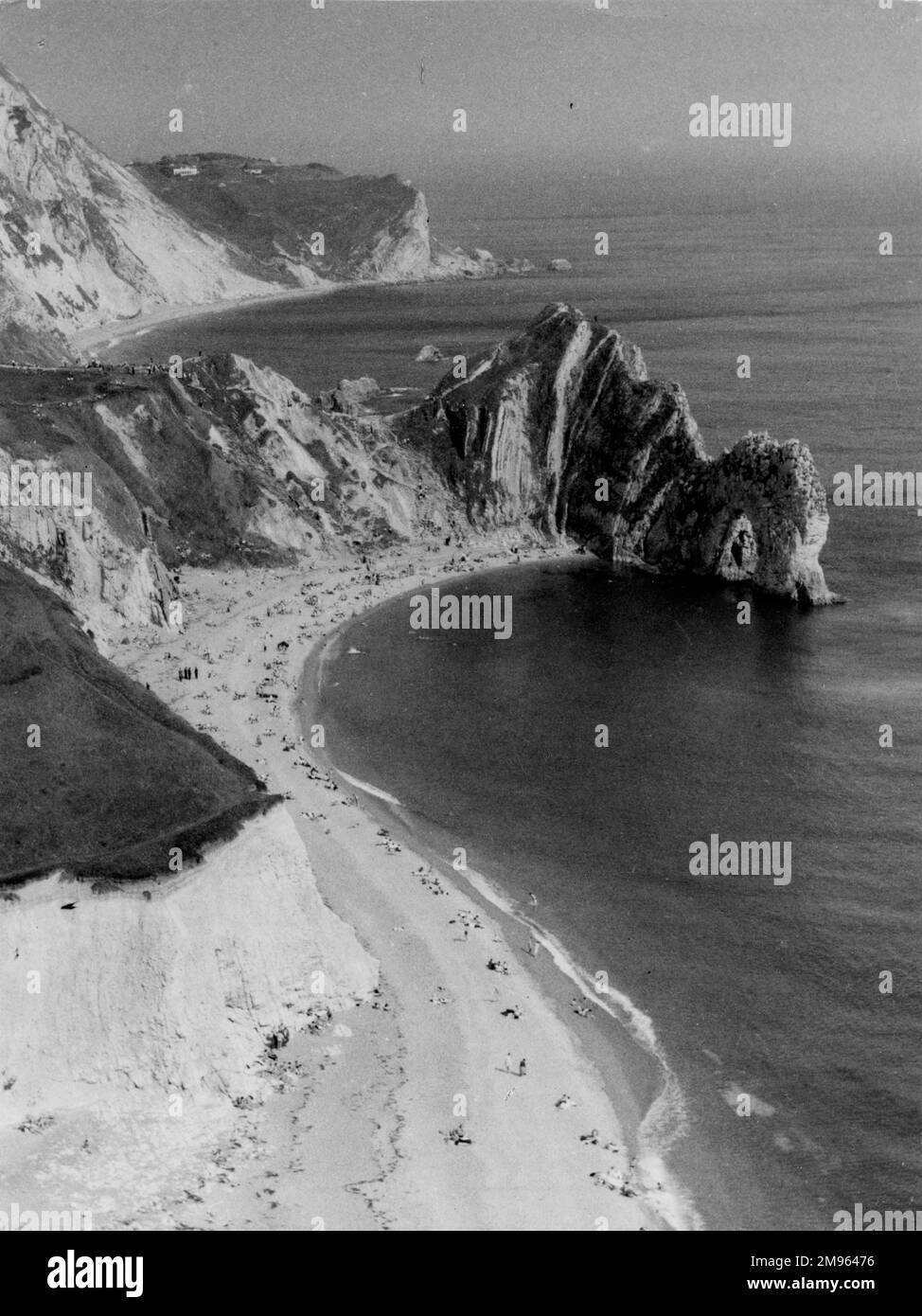A striking impression of the Dorset (England) coastline, with its cliffs and sands, seen here at Durdle Dor, a fine cliff formation, with an arched rock. Stock Photo