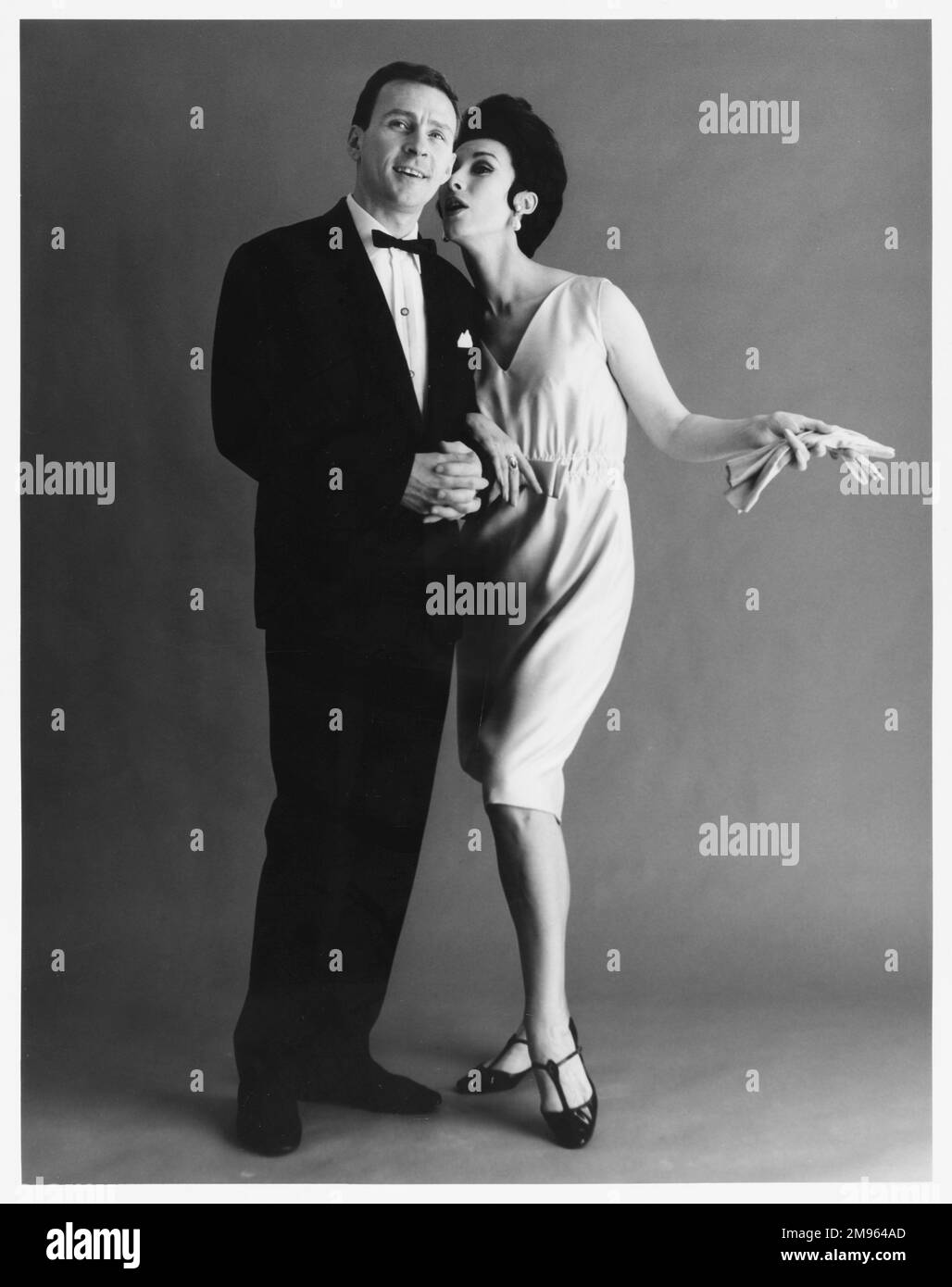 A couple in formal evening dress pose for the camera Stock Photo Alamy