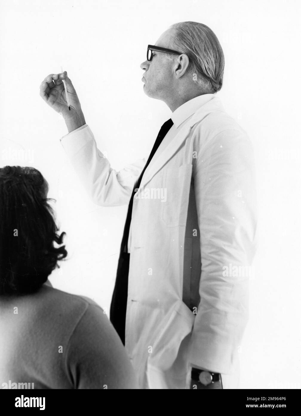Seeing a doctor Black and White Stock Photos & Images - Alamy