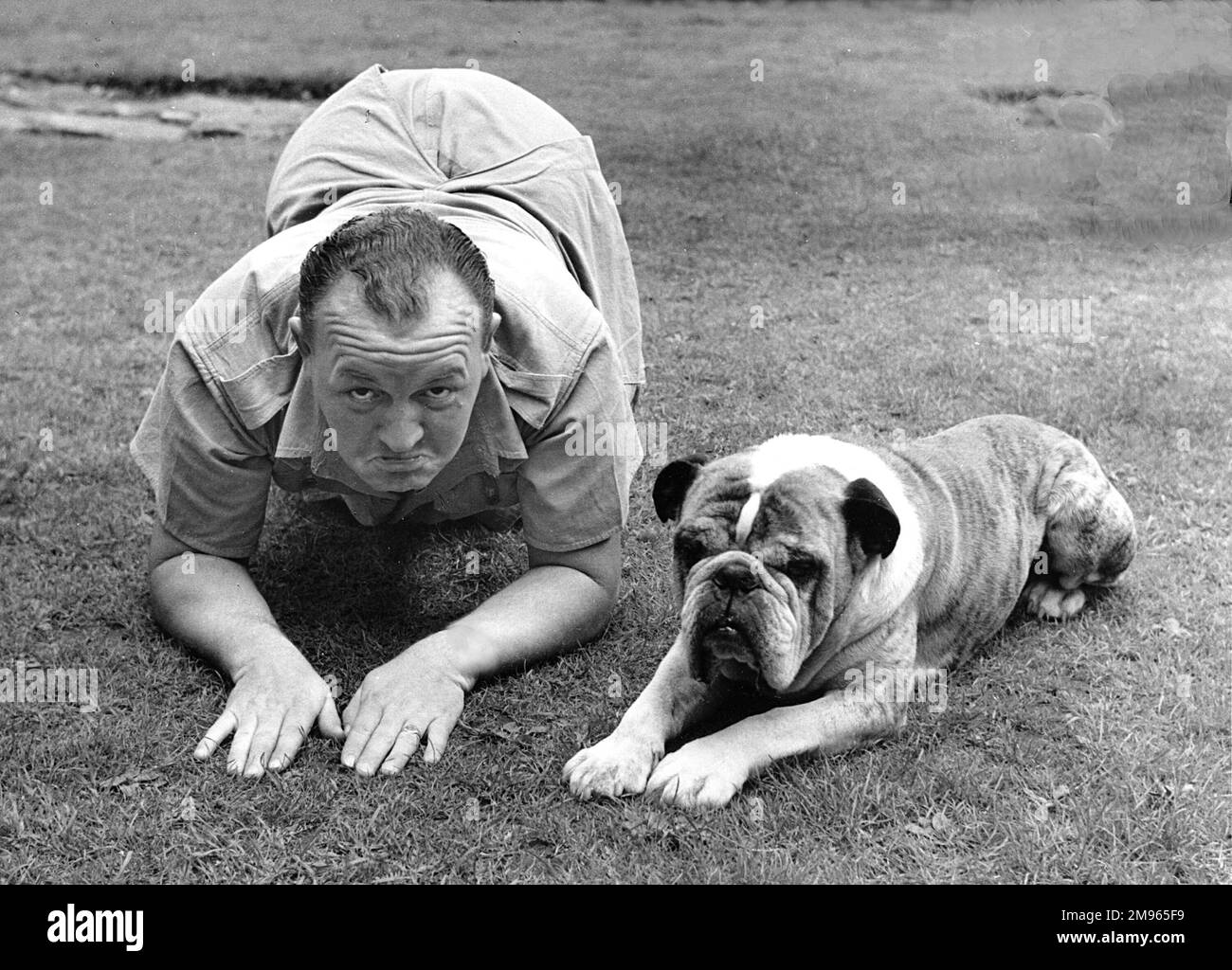 A British bulldog and his lookalike master! Stock Photo