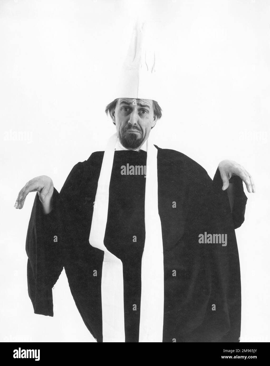 A limp-wristed priest (or chef)! Stock Photo