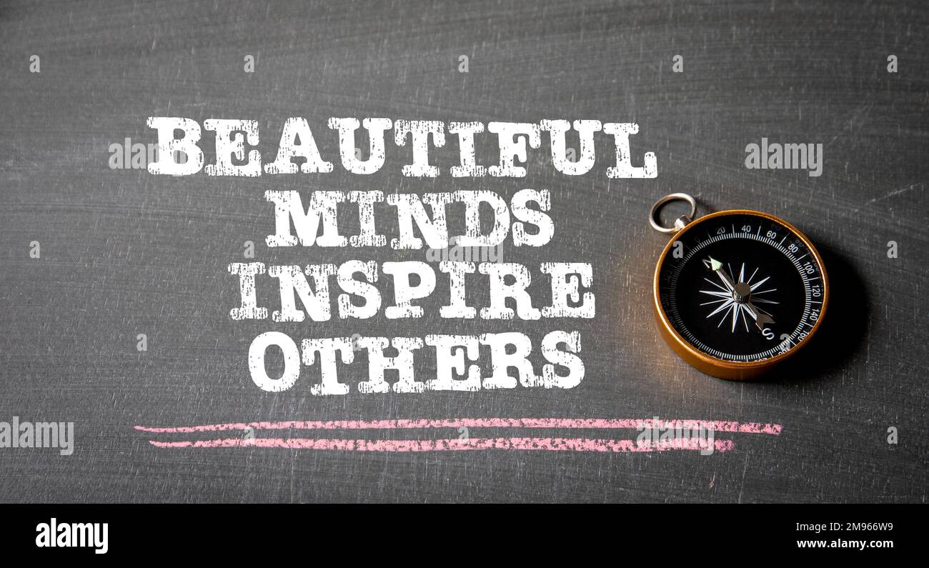 Beautiful Minds inspire others. Text on black chalk board. Stock Photo
