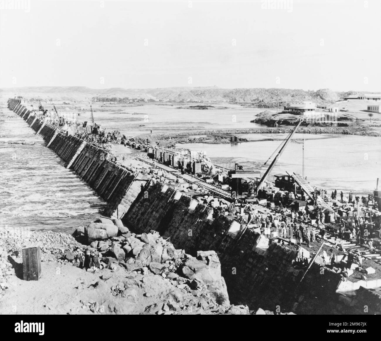 View downstream of the old or low Aswan Dam on the River Nile in Egypt during construction. Stock Photo