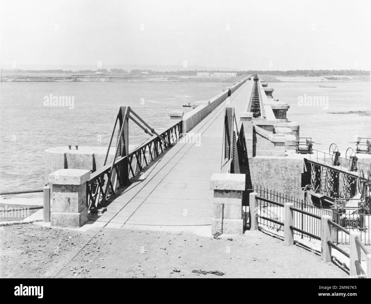 Roadway and swing bridge over lock on the Assiut or Asyut Barrage on the River Nile in Egypt, about 350 miles downstream from the Aswan Dam. Stock Photo